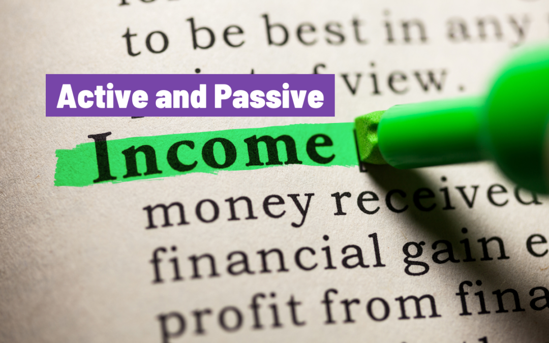 text on a page that says active and passive income highlighted in two colors with the tip of a green highlighter pen visible over other words related to finance.