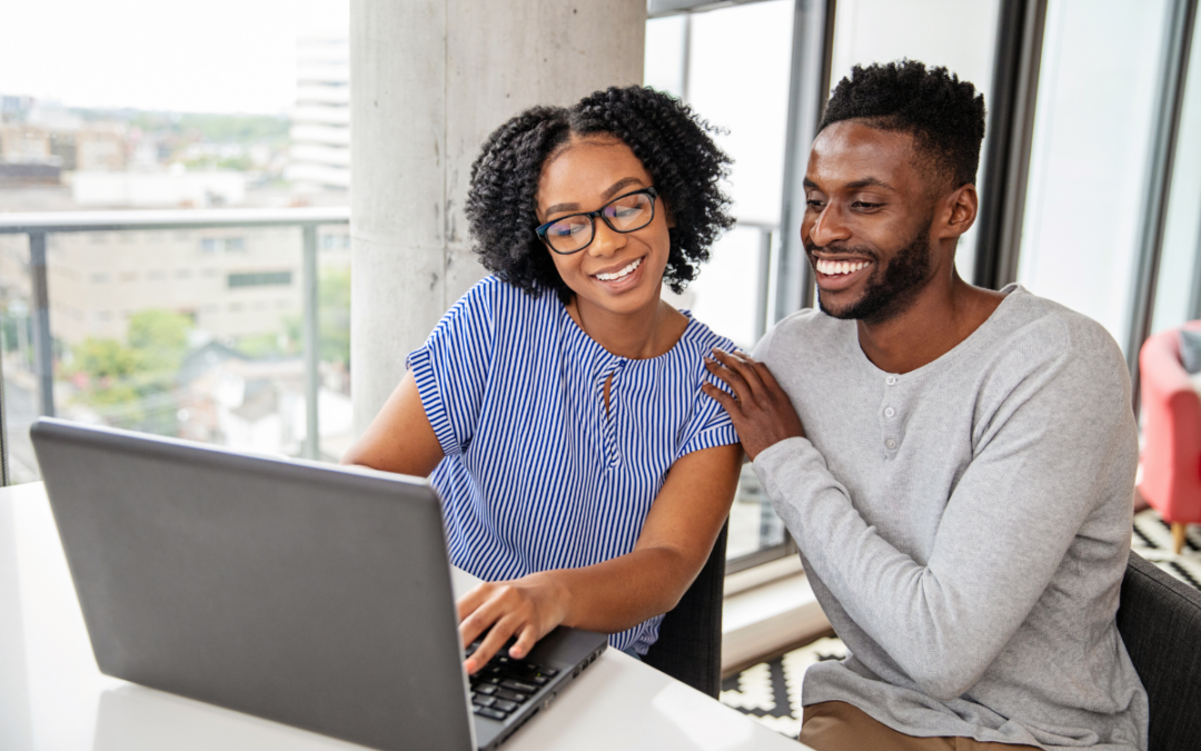 smiling-couple-at-computer-building-good-credit